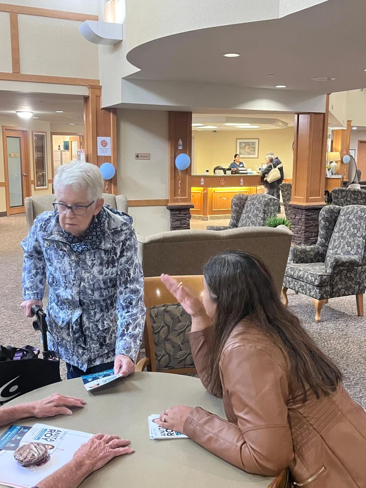 anita-roy-listening-to-seniors-st-norbert-seine-river