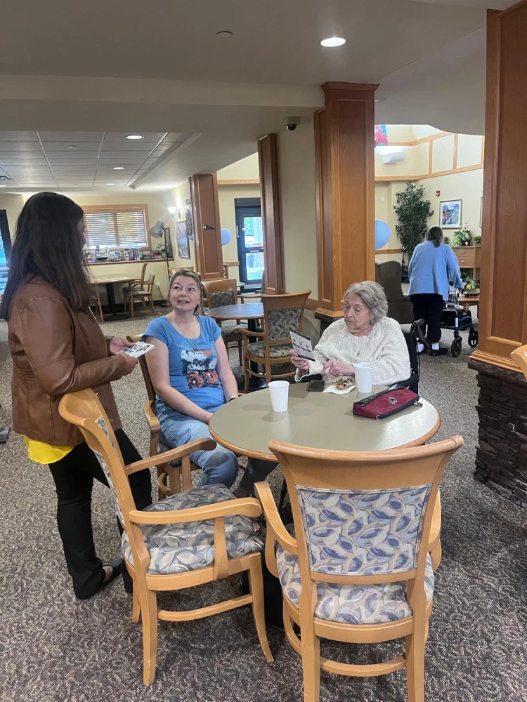 anita-roy-listening-to-seniors-st-norbert-seine-river