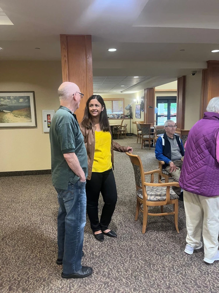 anita-roy-listening-to-seniors-st-norbert-seine-river