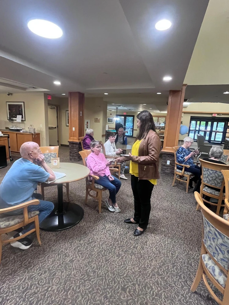 anita-roy-listening-to-seniors-st-norbert-seine-river